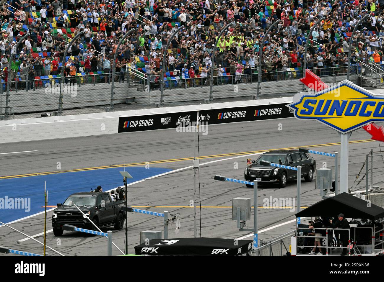 President Donald Trump rides in the presidential limousine known as ...