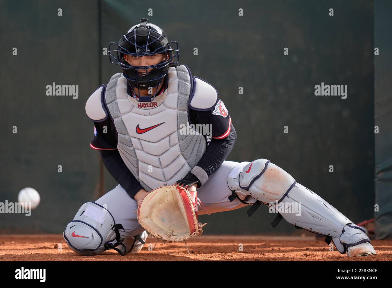 Cleveland Guardians catcher Bo Naylor eyes a ball during spring ...