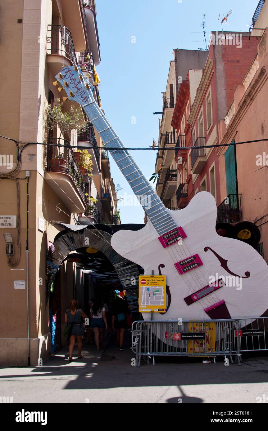 Big rock guitar in ornated street during the Summer Gracia Festival, 2019, the popular Fiestas de Gracia in august, Vila de Gràcia, Barcelona, Spain Stock Photo