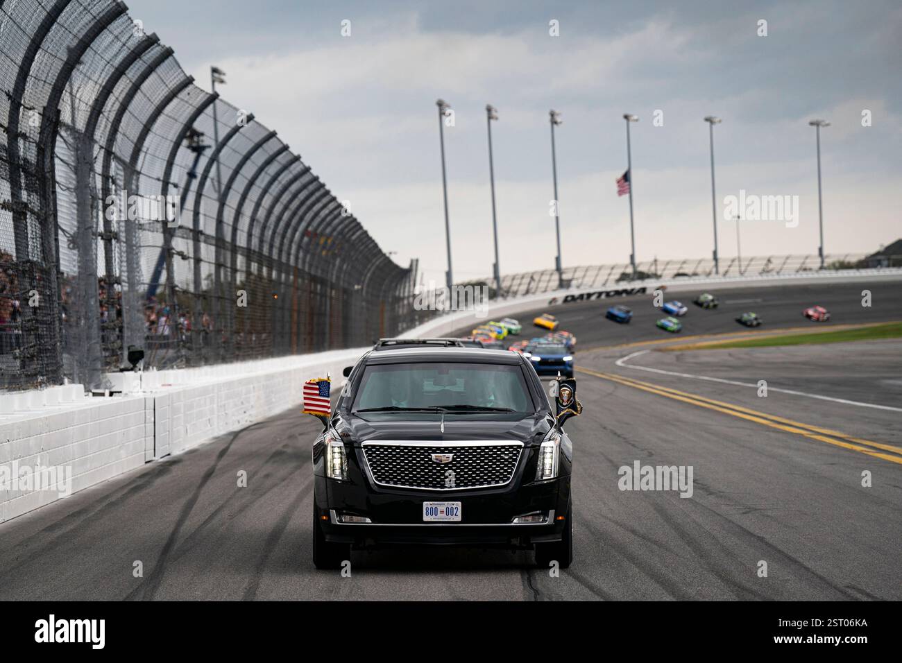 President Donald Trump rides in the presidential limousine known as ...