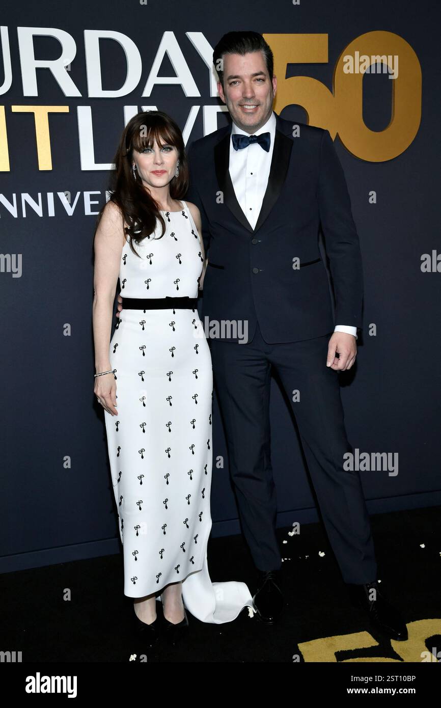 Zooey Deschanel, left, and Jonathan Scott attend "SNL50 The