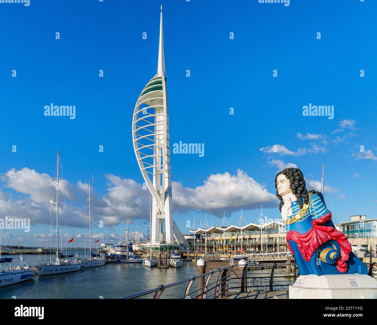 The colourful figurehead of HMS Marlborough with the Spinnaker Tower in Gunwharf Quays in Old Portsmouth, south coast Hampshire, UK Stock Photo