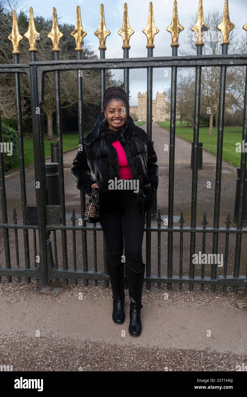 Windsor Berkshire England UK. 17.02.2025. Woman tourist posing for a holiday snap along the Long Walk in Windsor Berkshire UK. Stock Photo
