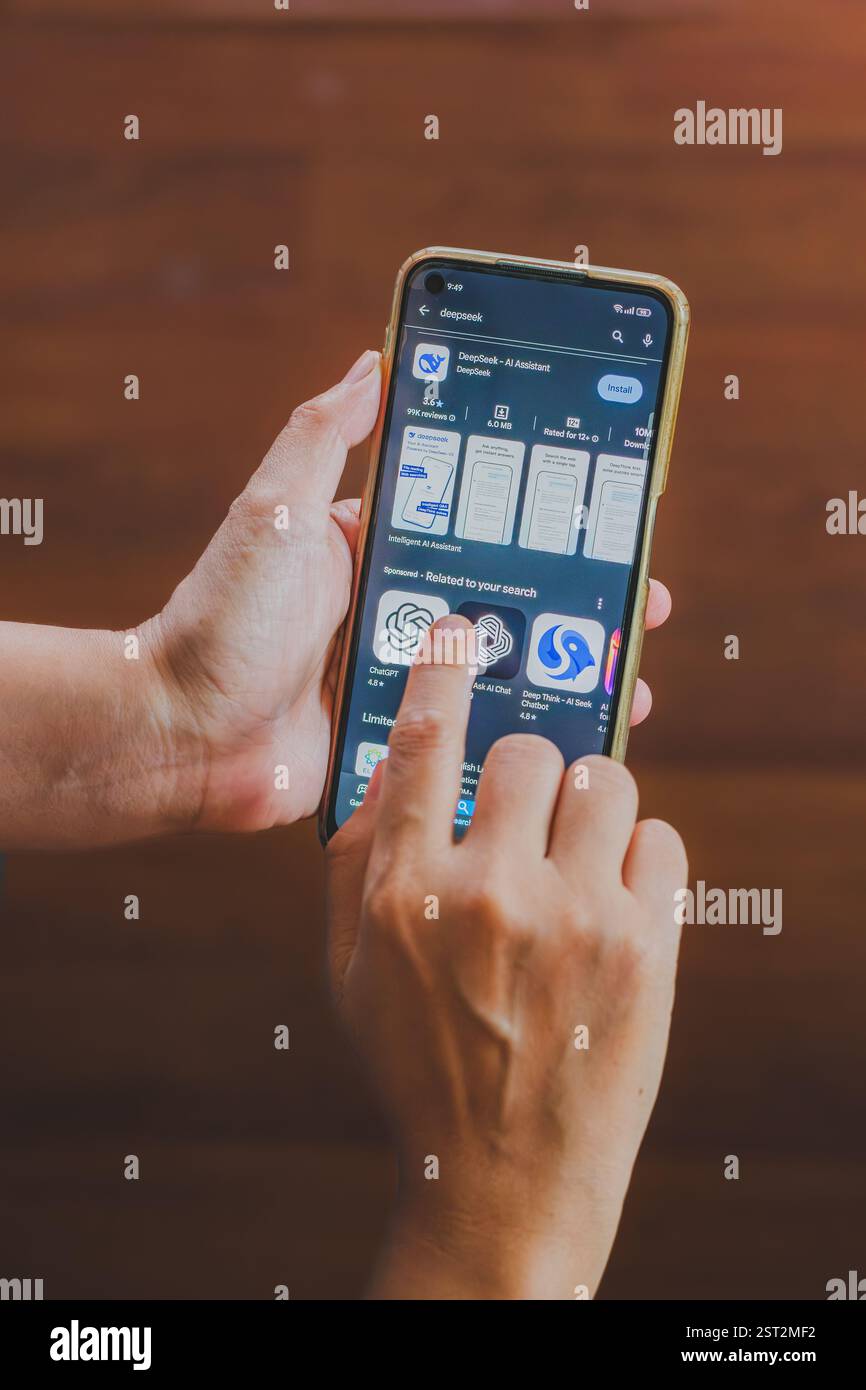Balikpapan, Indonesia - February 16th 2025. The image captures the interaction with a mobile app store and highlights the DeepSeek AI assistant app. Stock Photo