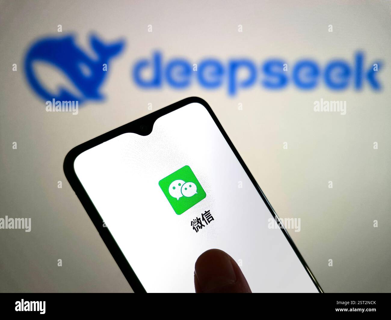 suqian-china-february-17-2025-an-illustration-shows-a-wechat-logo-inside-a-smartphone-with-a-deepseek-logo-in-the-background-in-suqian-jiangsu-2ST2NCK.jpg