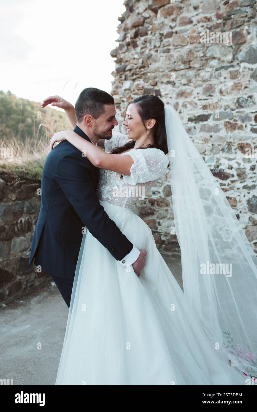 Beautiful newlyweds hugging smiling hi-res stock photography and images ...