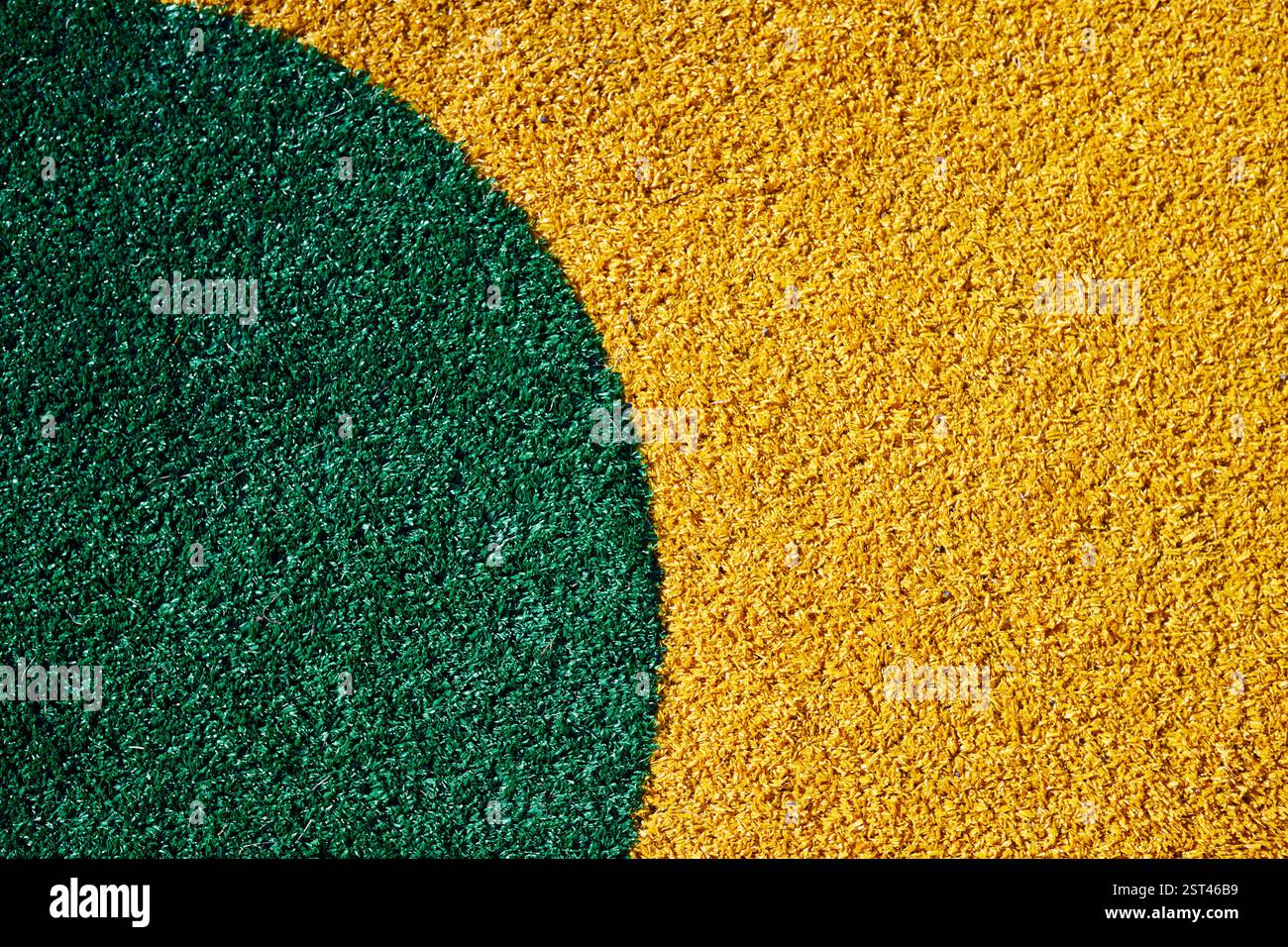Vibrant green circle on textured yellow surface Stock Photo