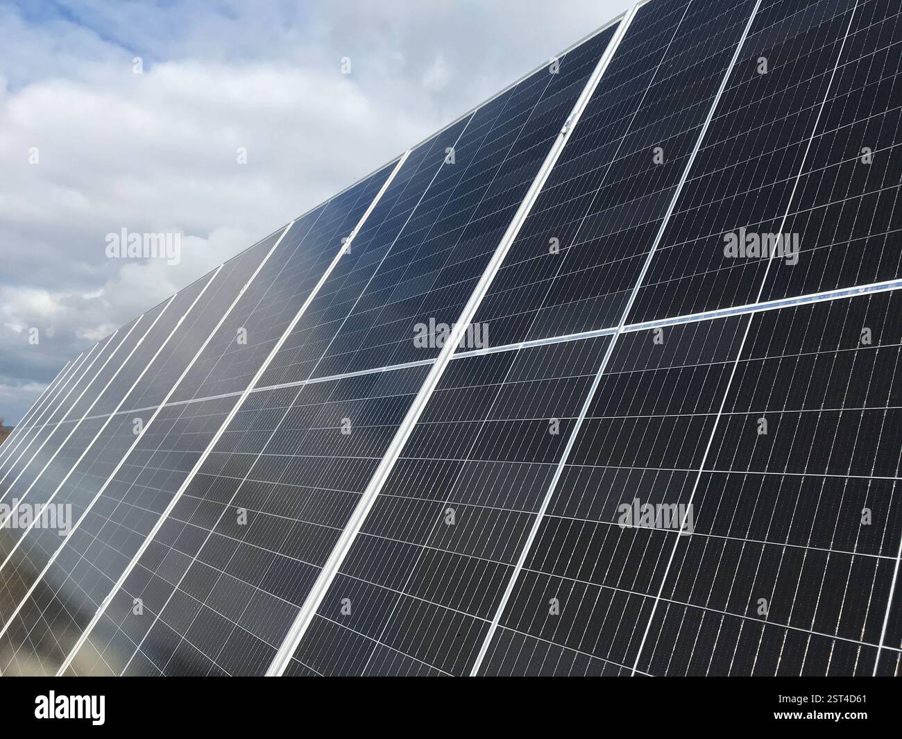 Photovoltaic panel detail in front of cloudy sky Stock Photo