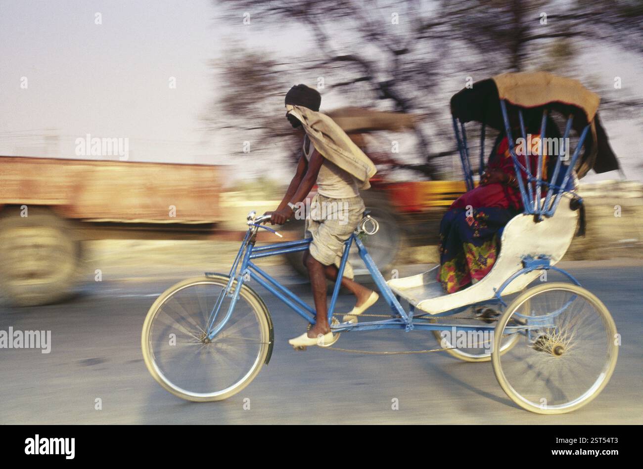 Man riding rickshaw cycle, india Stock Photo - Alamy