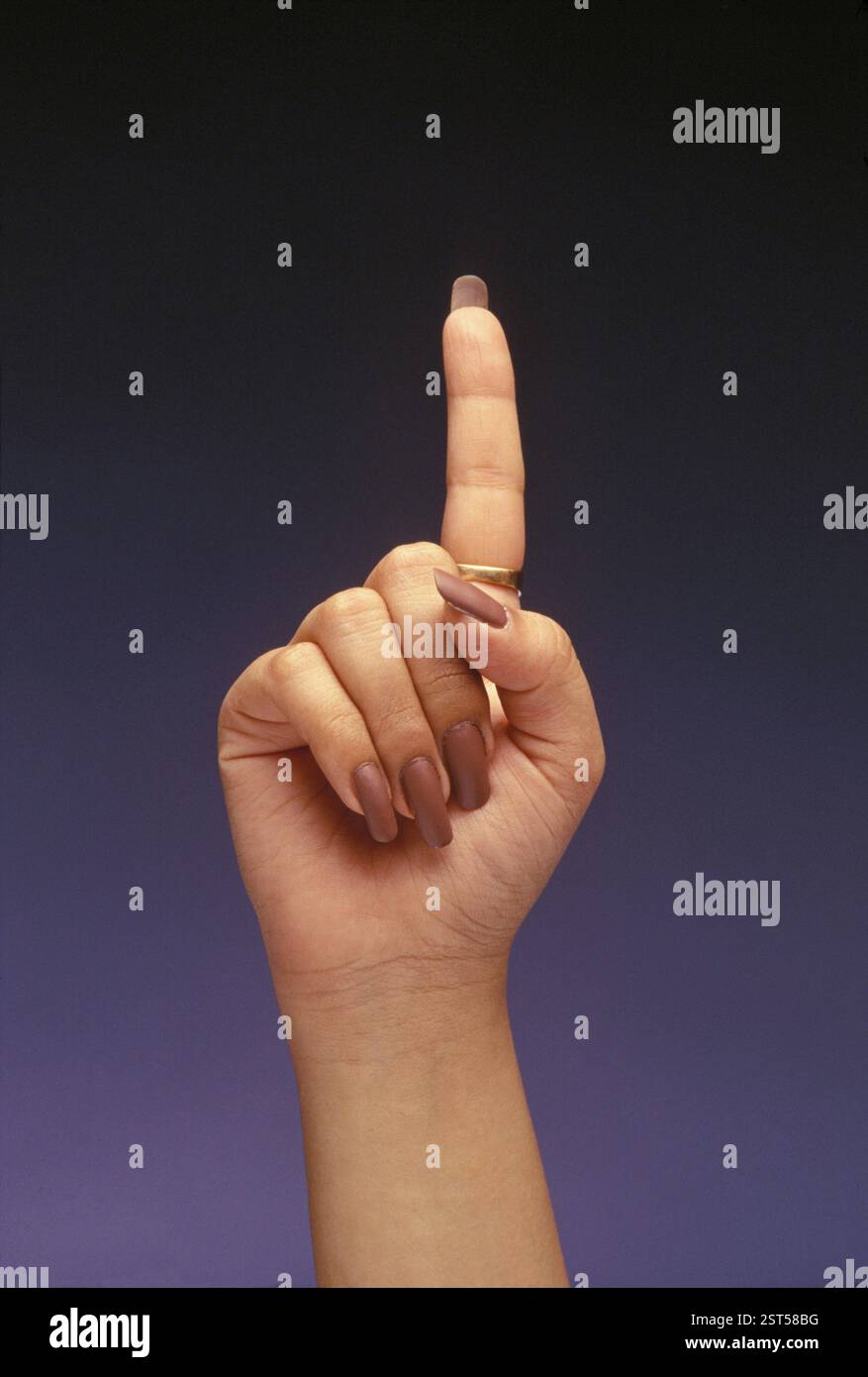 Hand showing one finger Stock Photo - Alamy