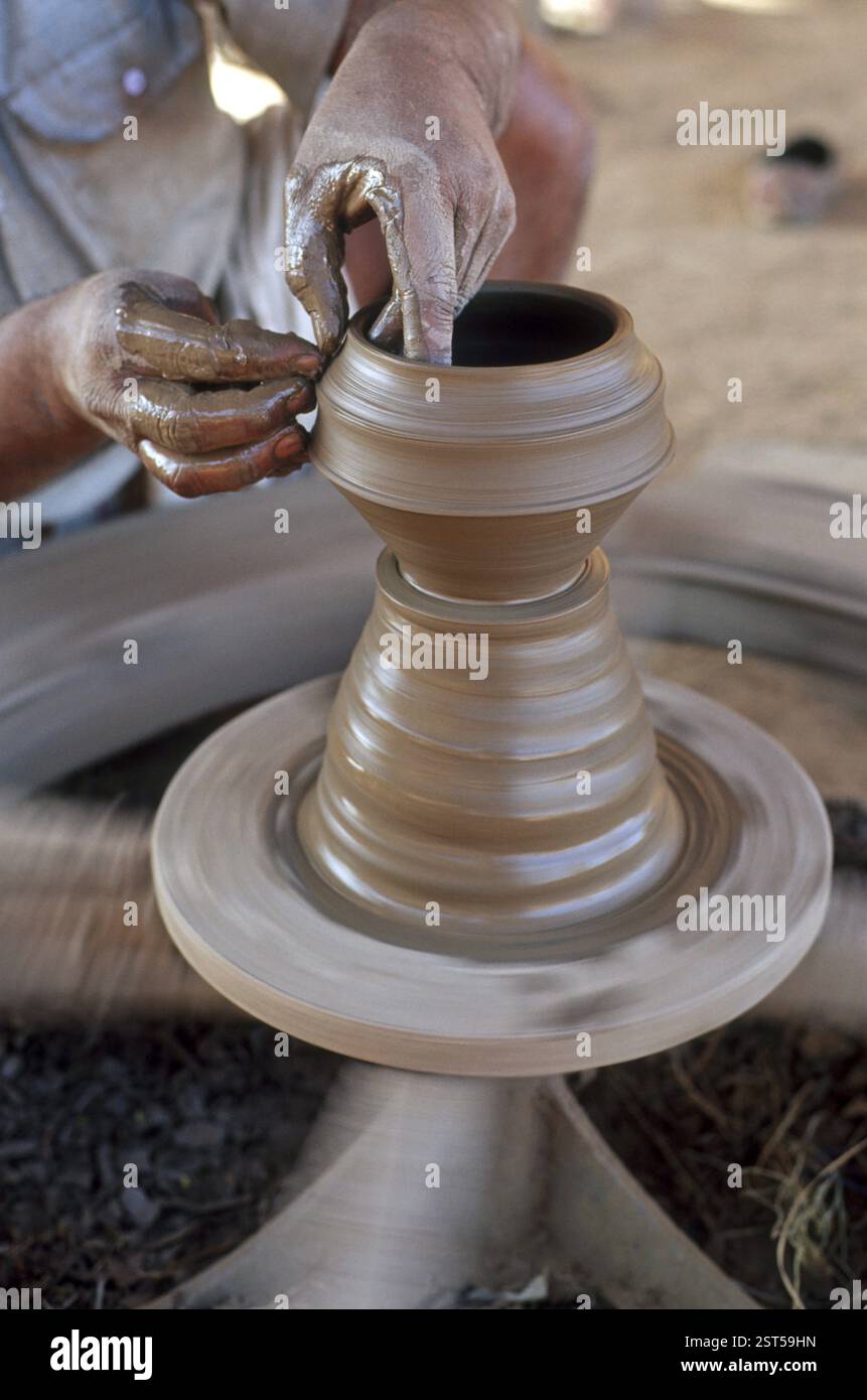 Potter making earthen pot, Close up on a traditional potter at work, india Stock Photo