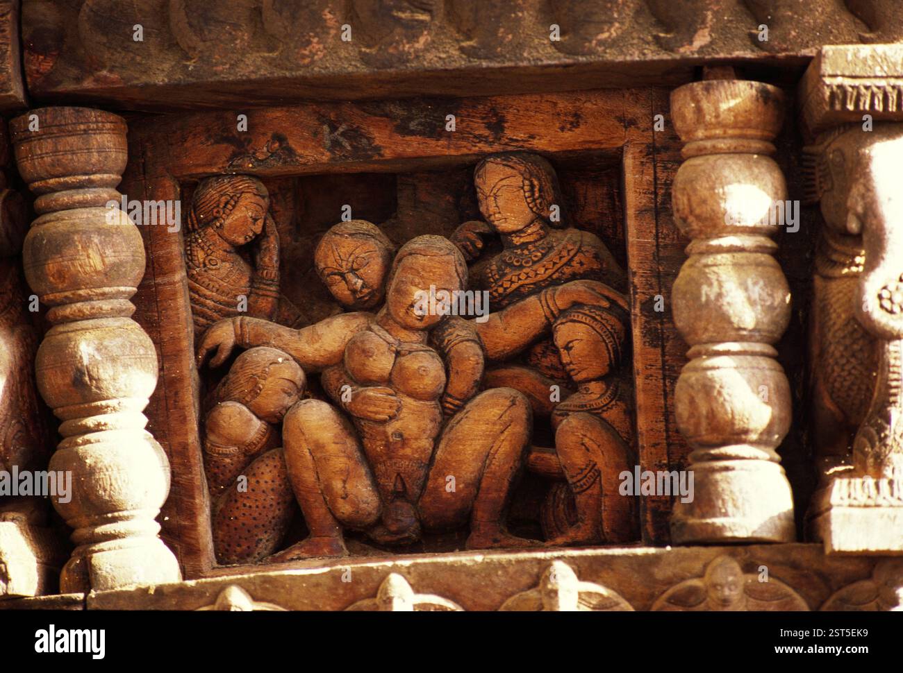 Child birth wood carving in temple car exhibited in folklore museum at Manasa Gangotri in Mysore, Karnataka, India, Asia Stock Photo