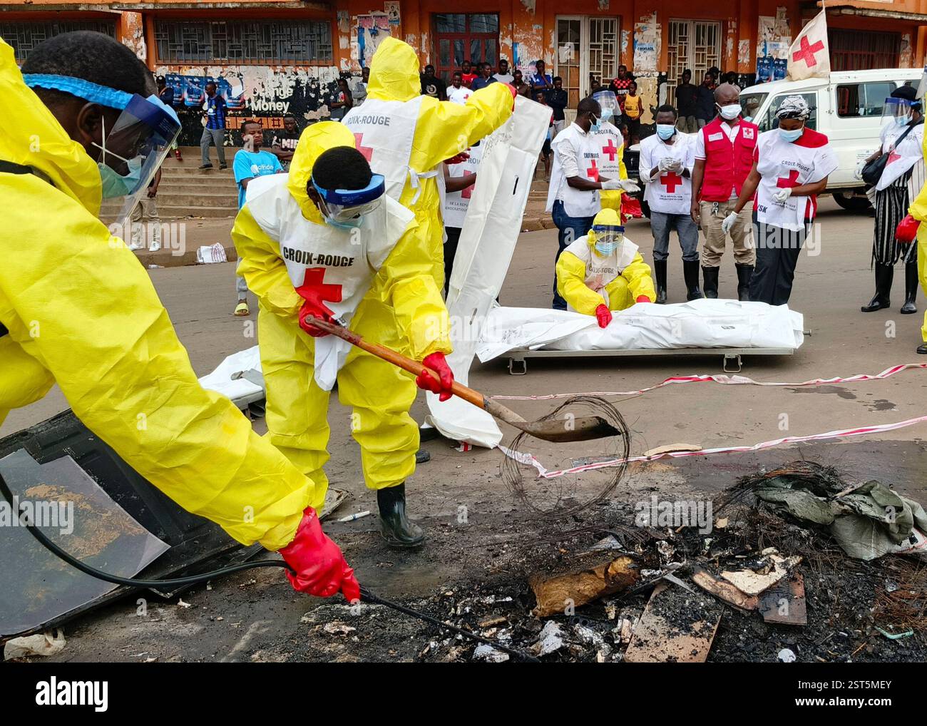 Red Cross workers clear the area in east Congo's second-largest city
