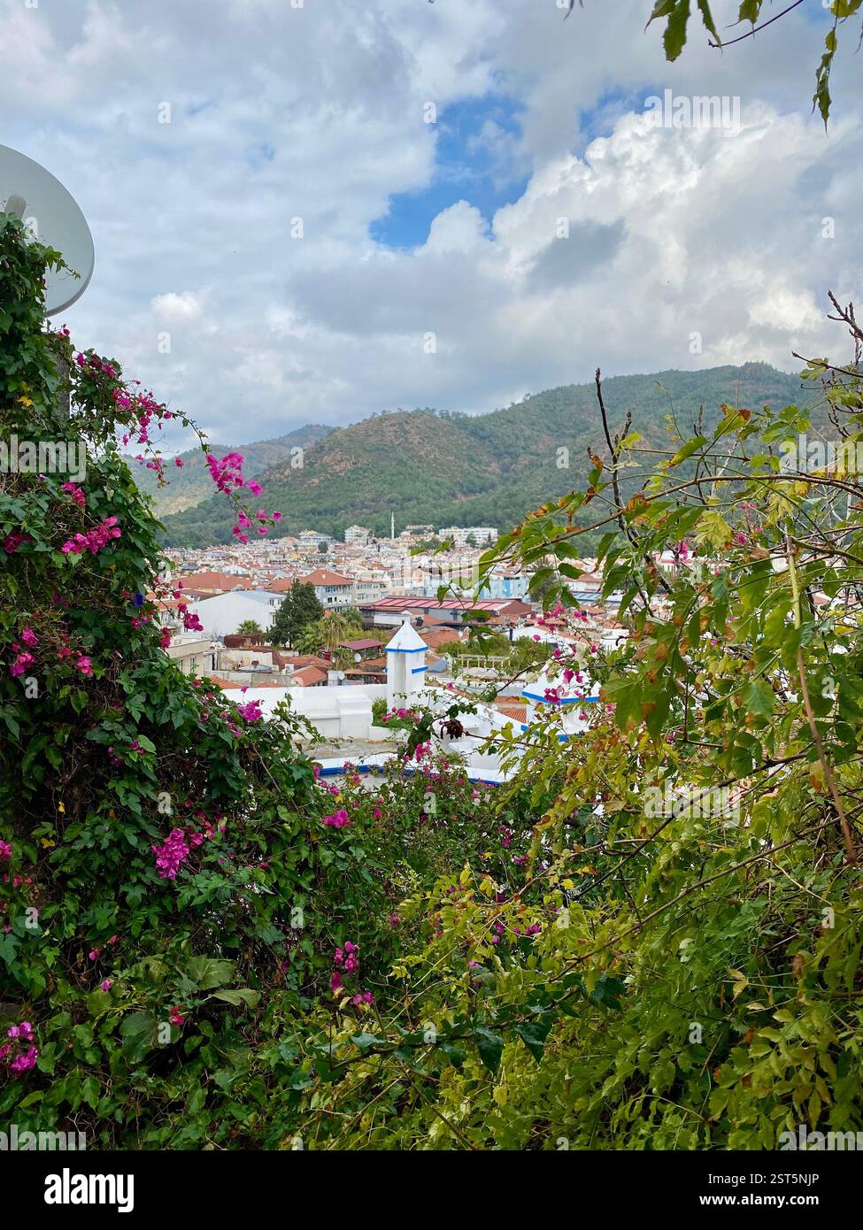View of a Turkish town surrounded by mountains and greenery - Smartphone Captured Stock Image