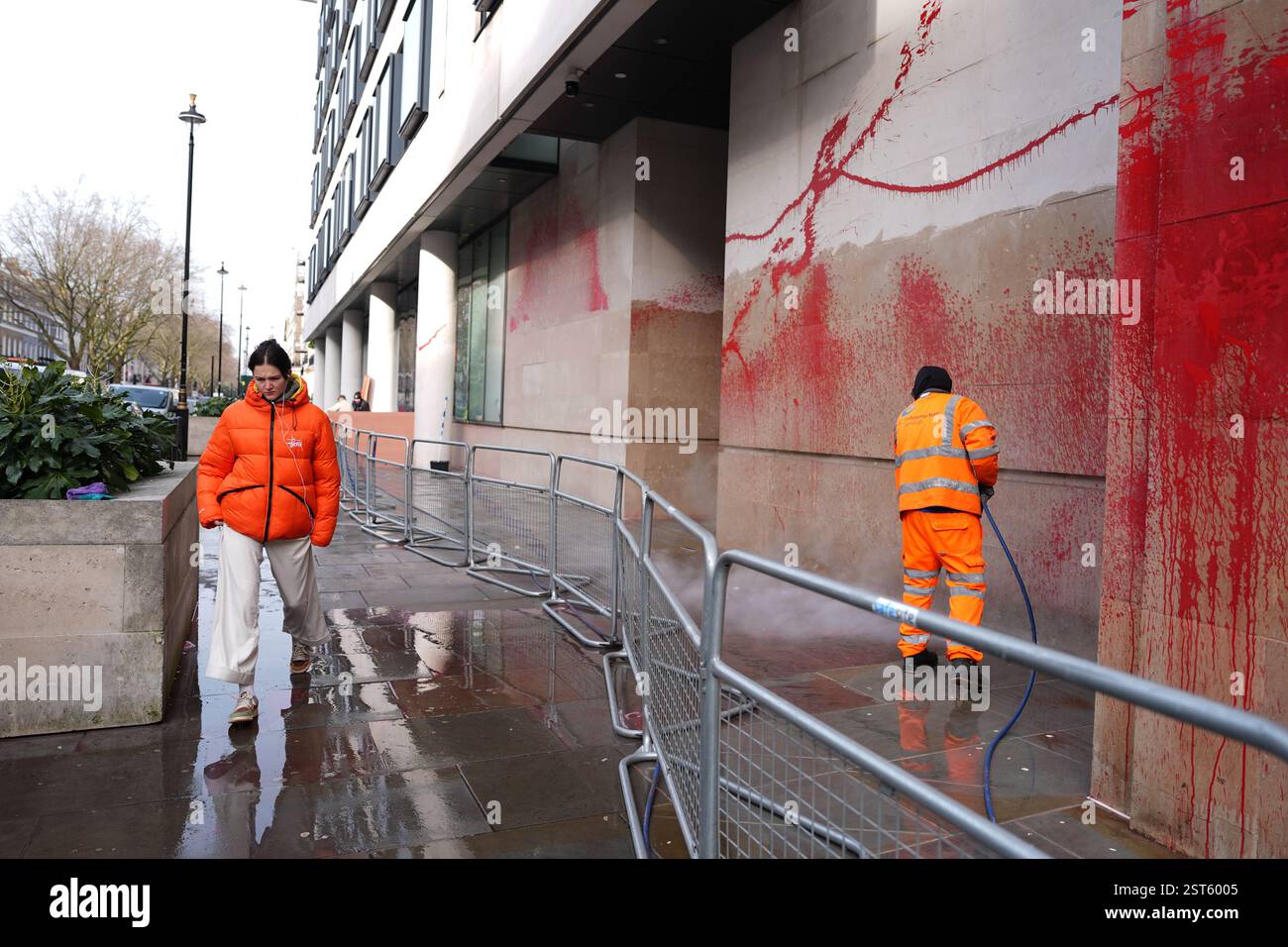 A worker cleans paint from the walls of the BBC after Palestine Action ...