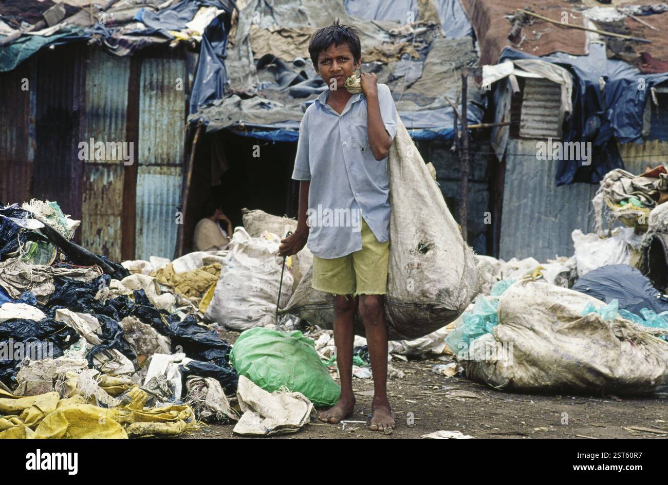 Rag picker boy standing at garbage Stock Photo - Alamy