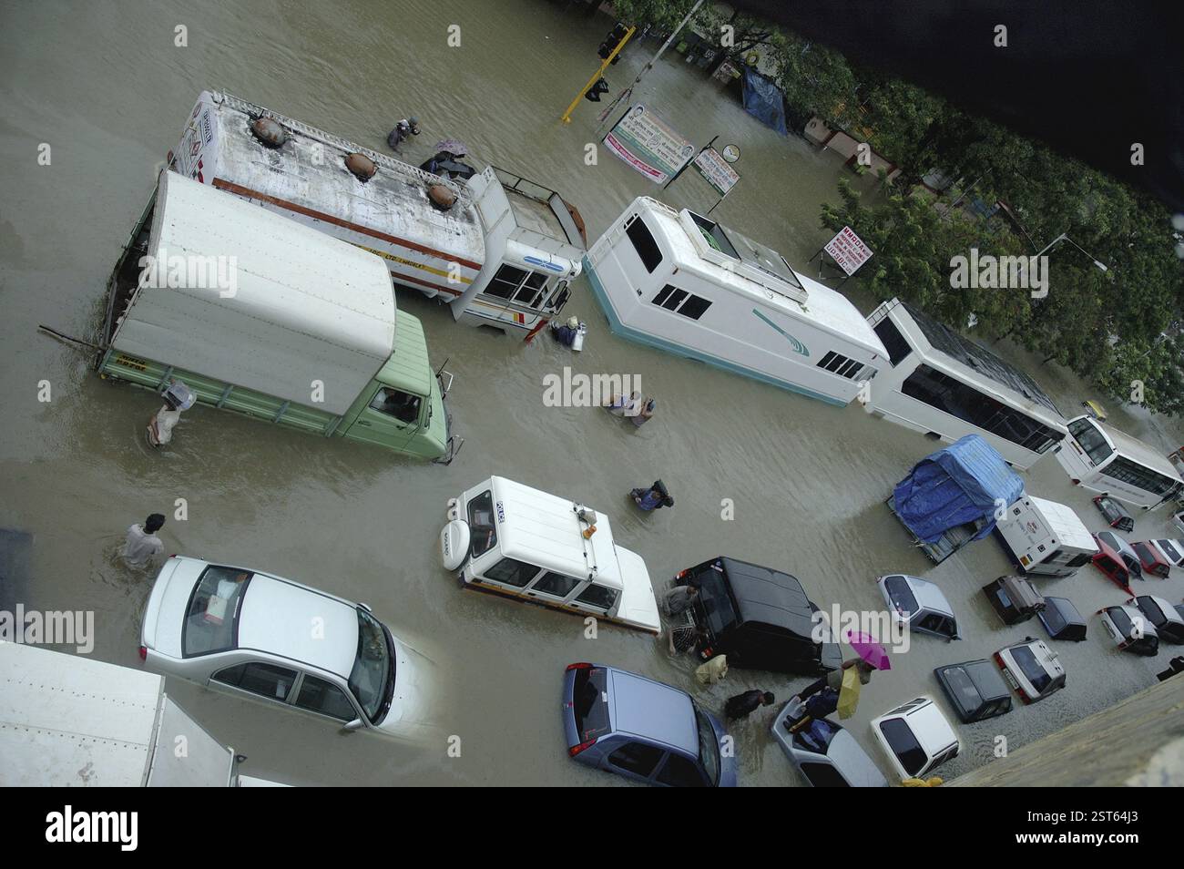 Floods due to heavy rain, showing vehicles submerged in flooded water ...