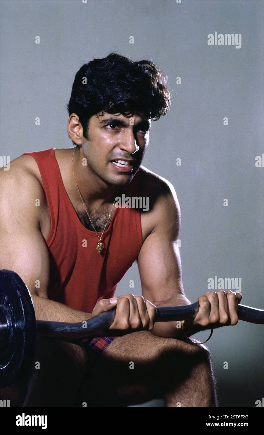 Man doing exercise using weight equipment MR#139 Stock Photo