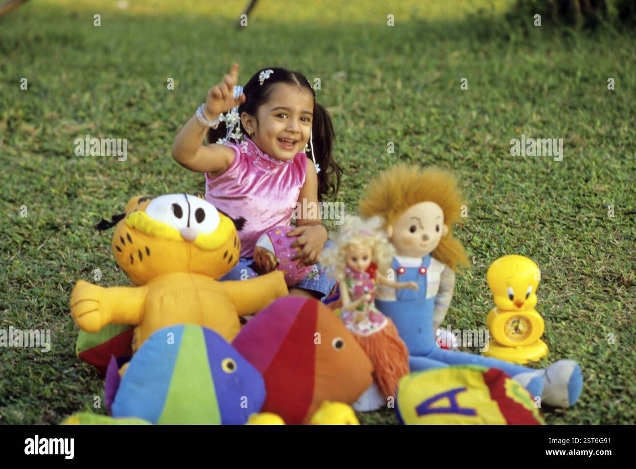 Two girls playing with dolls hi-res stock photography and images - Alamy