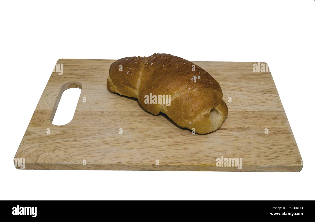 Rustic baked bread placed on a wooden board in a simple presentation ...