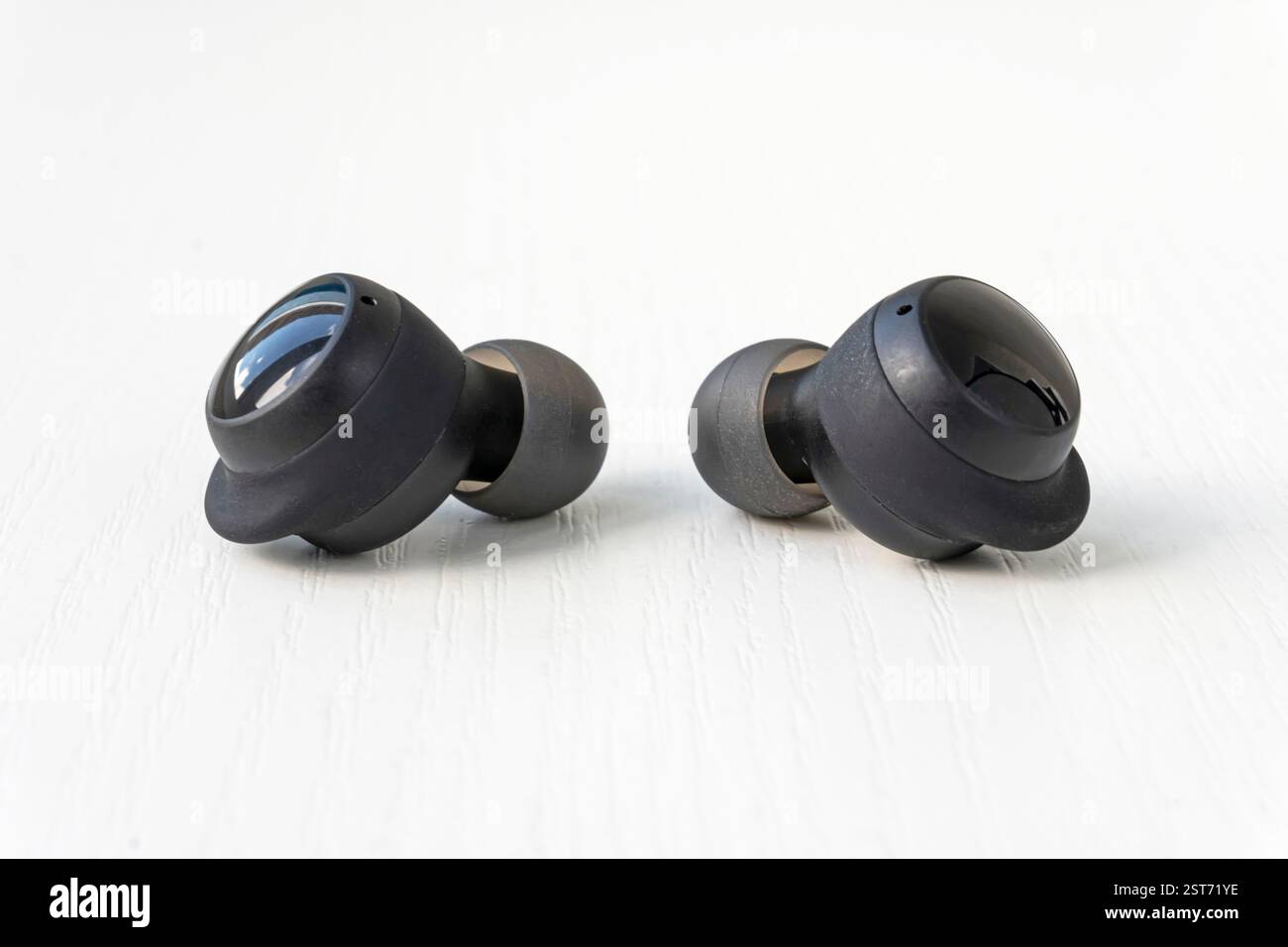 Wireless headphones on a white background. Two wireless headset closeup Stock Photo