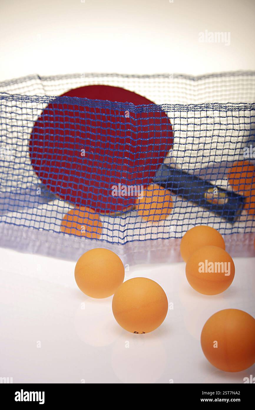 Table tennis balls with racket and net Stock Photo - Alamy