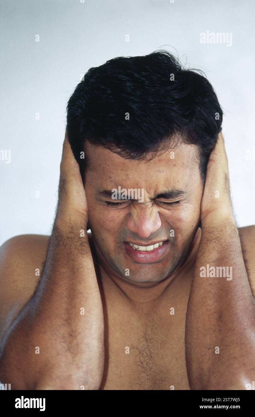 Man suffering through headache, india MR#511 Stock Photo