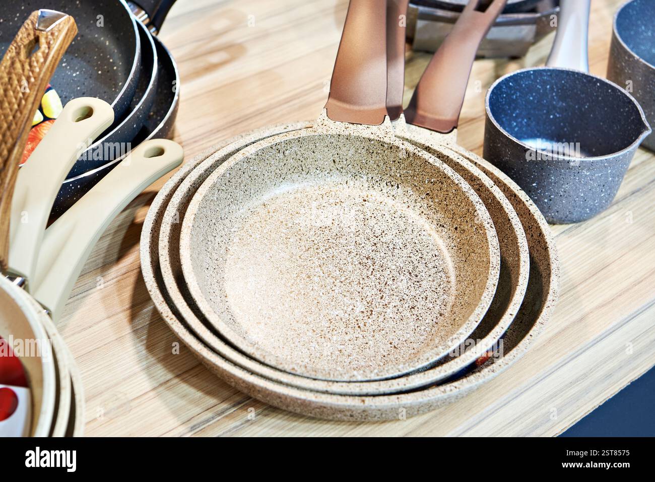 Modern non-stick pans in the store Stock Photo