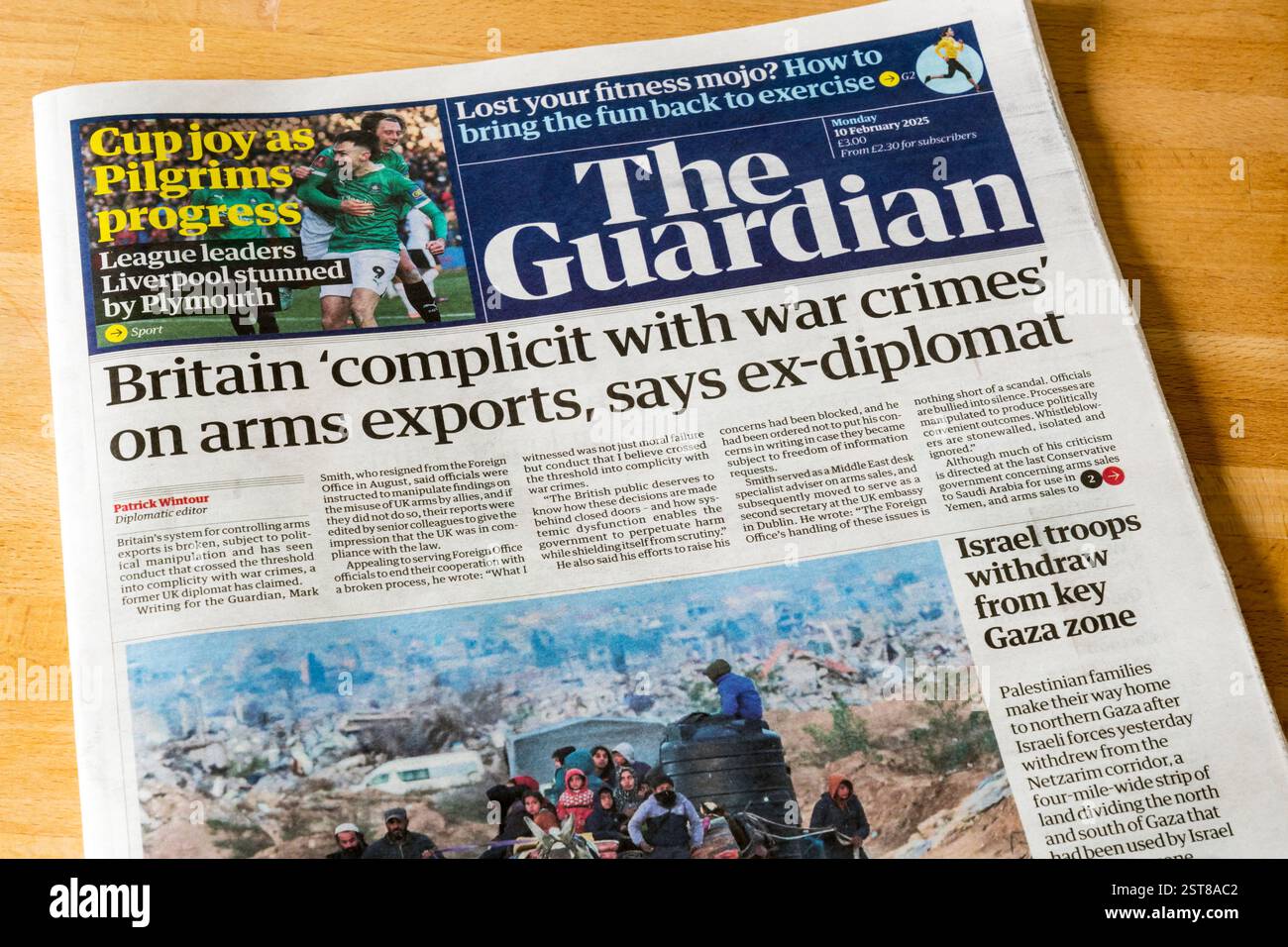 10 February 2025. Guardian headline is Britain 'complicit with war crimes' on arms exports, says ex-diplomat. Stock Photo
