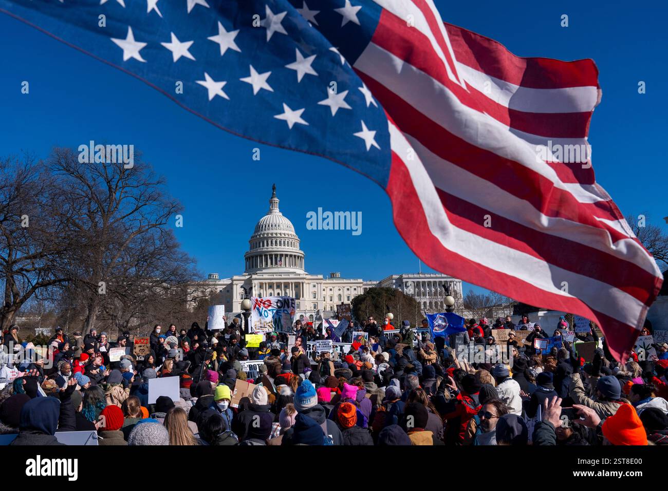 An American flag is flown upside down during the "No Kings Day" protest ...
