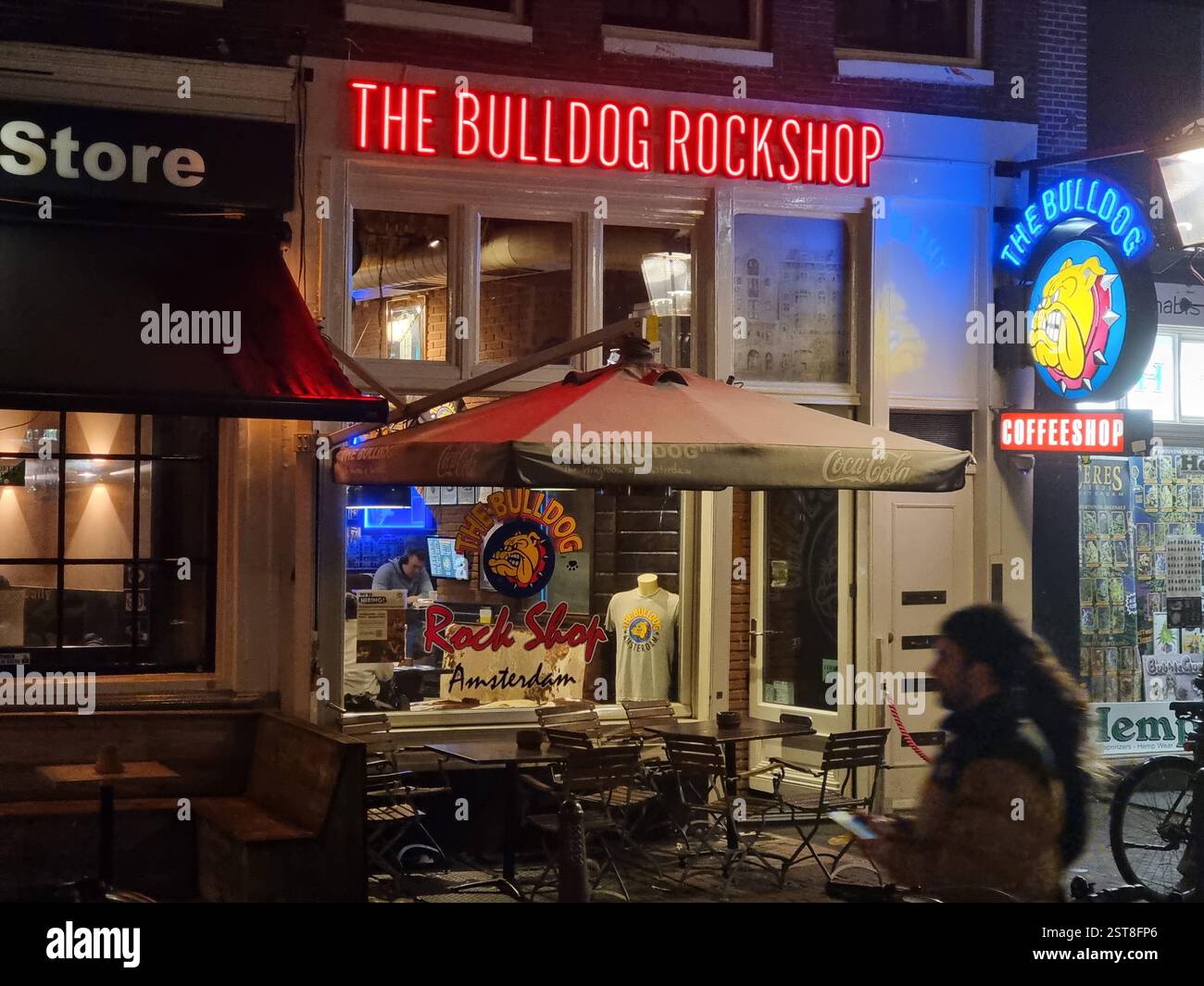 Facade and terrace of the Bulldog Rockshop, a coffeeshop (cannabis) with relics of the heroes of classic rock music in Amsterdam, The Netherlands - Smartphone Captured Stock Image