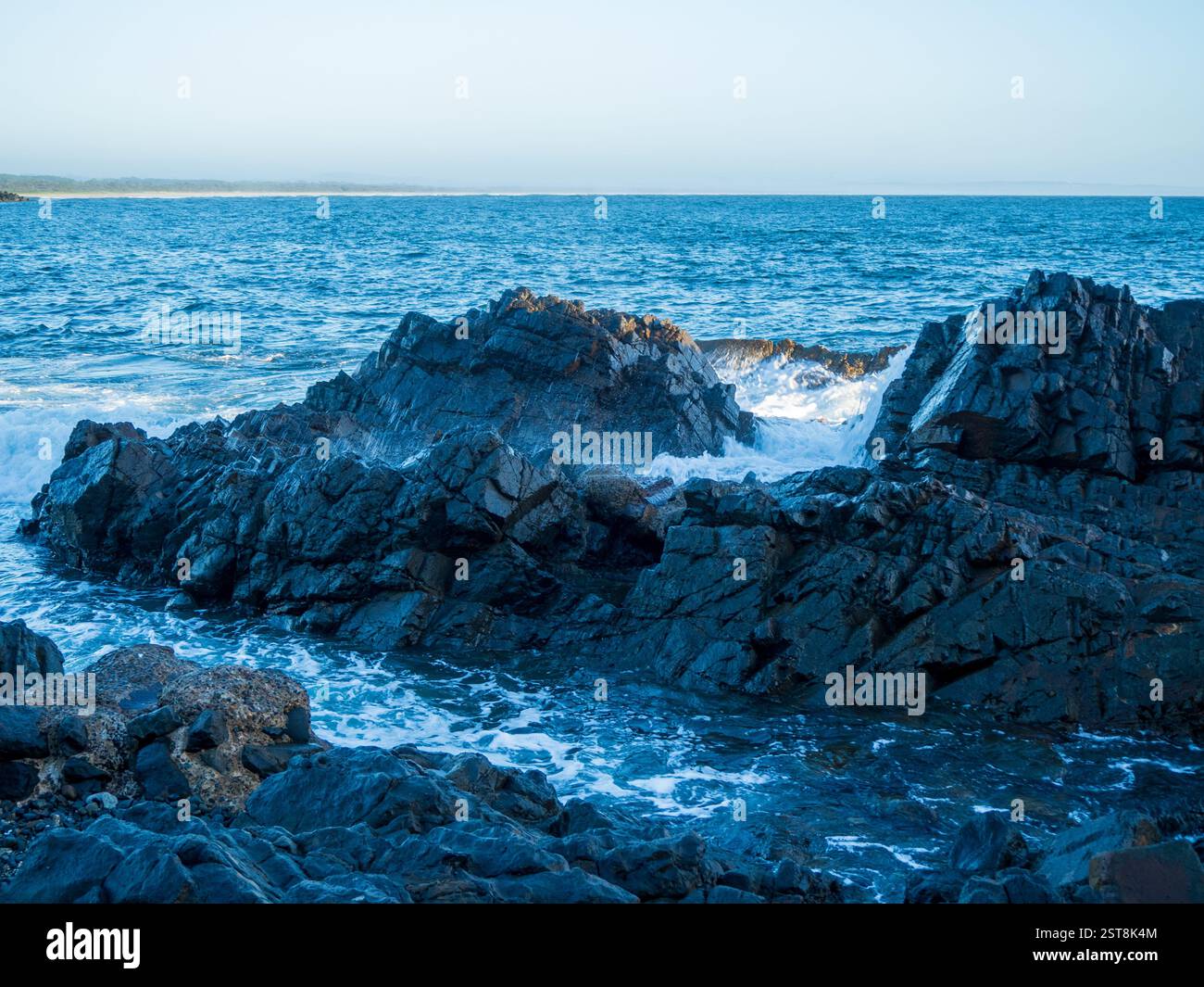 Foamy waves crashing over rocks hi-res stock photography and images - Alamy