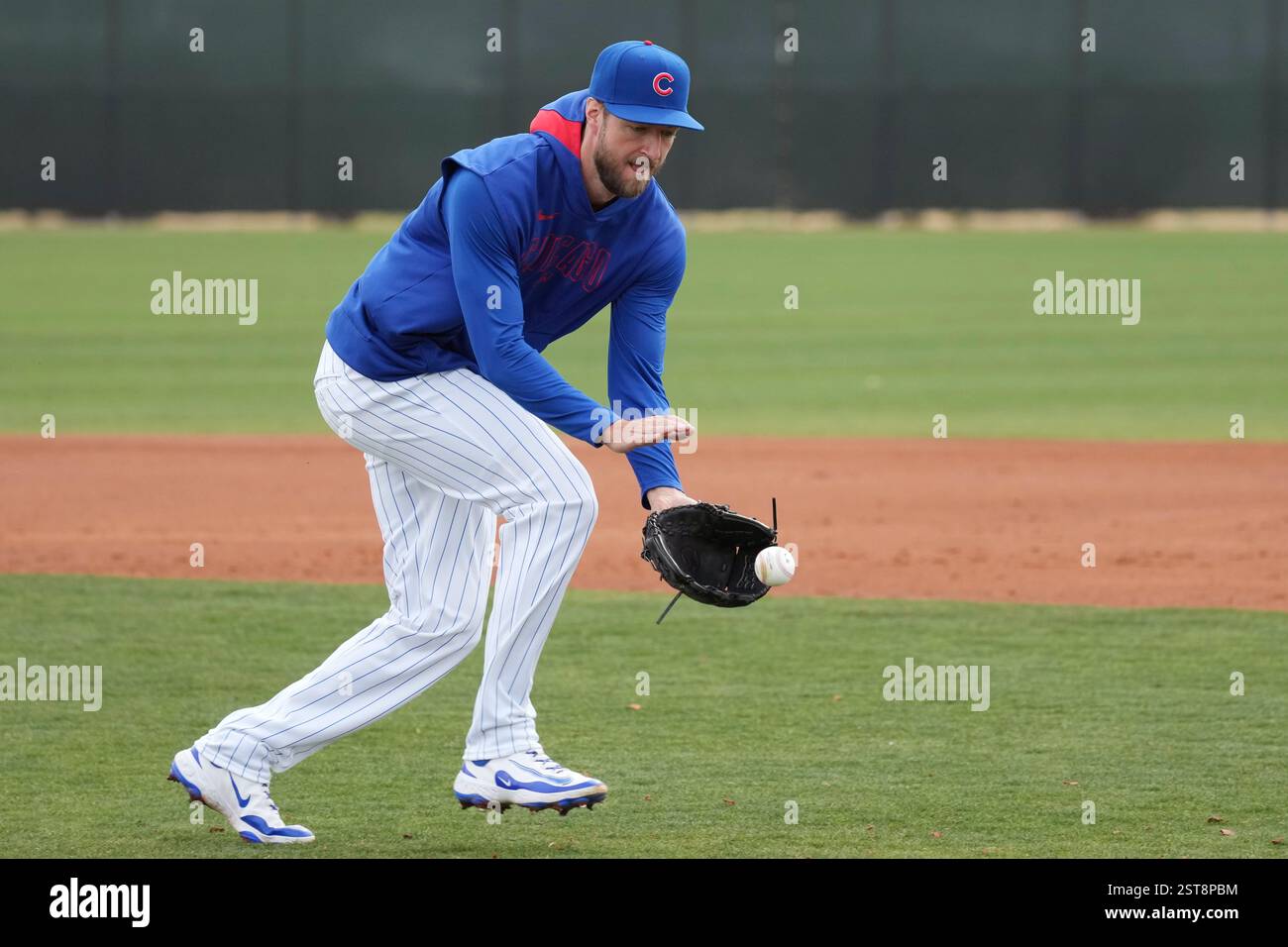 Chicago Cubs pitcher Colin Rea fields a grounder at the Cubs baseball ...