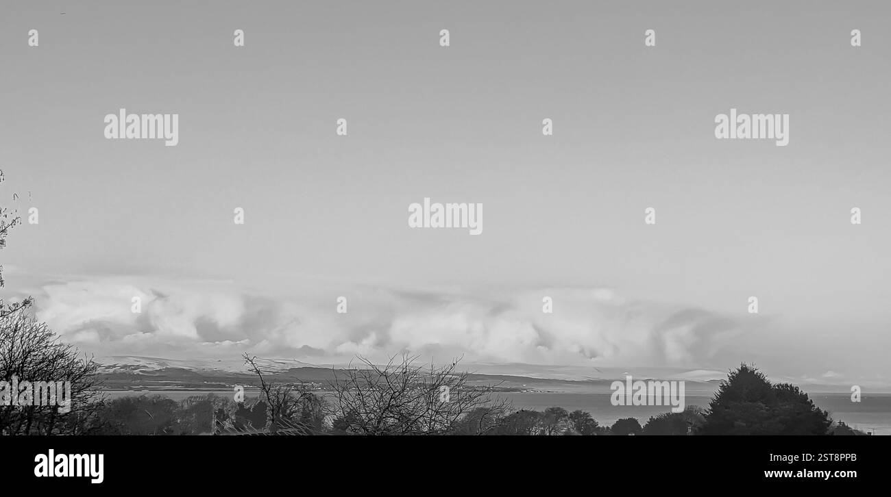 Dramatic Atmospheric Snowy Landscape, Snow storm, blizzard approaching over the hills and mountains in the Scottish Highlands - Smartphone Captured Stock Image