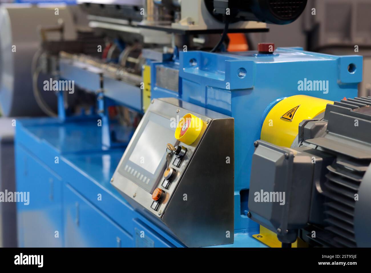 Close up of automated plastic extruder machine. Selective focus. Stock Photo
