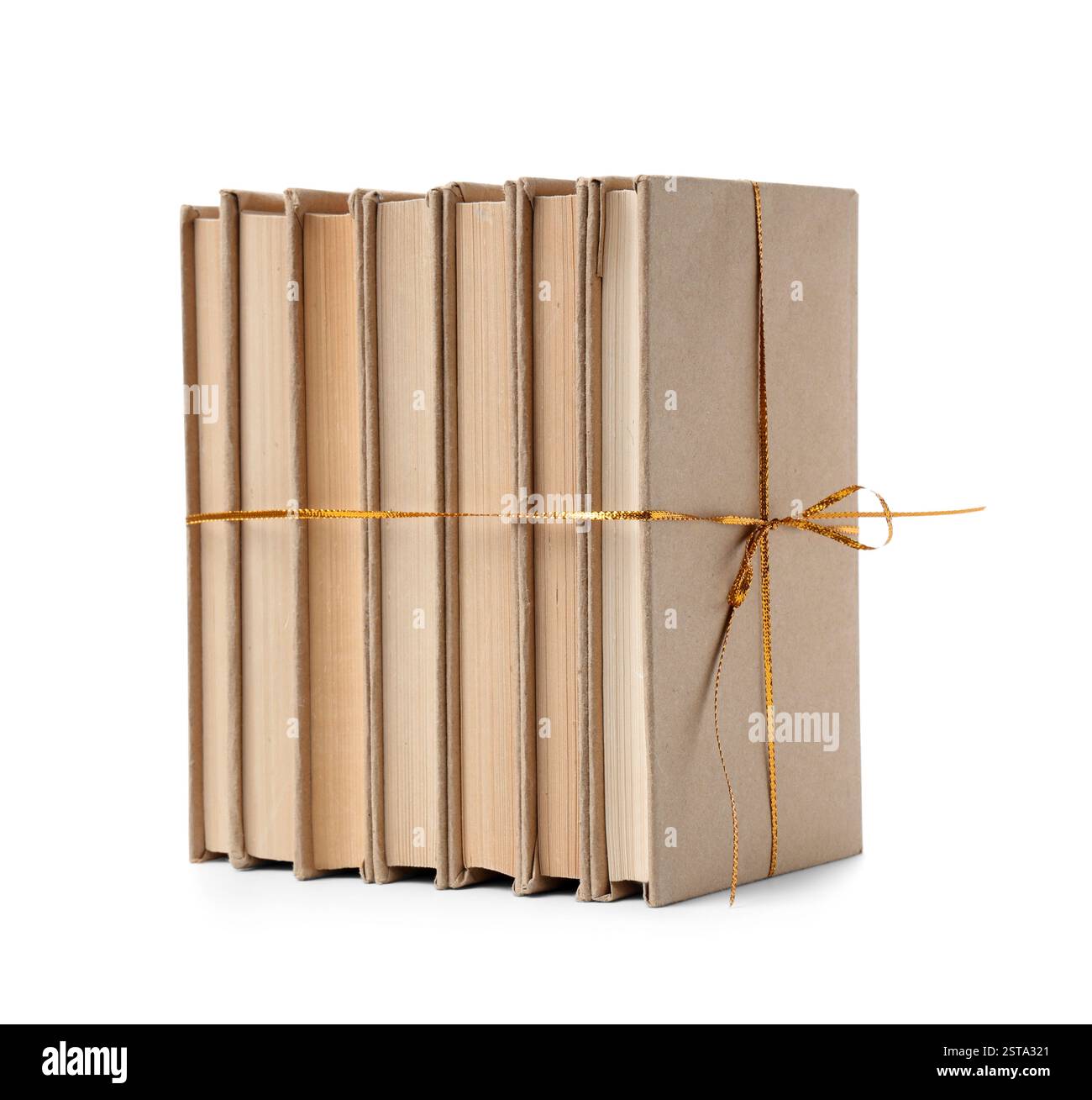 Stack of books with golden ribbon on white background Stock Photo - Alamy