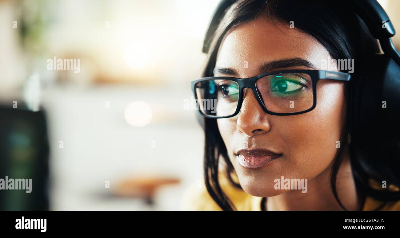 Coding, developer or woman in headphones for remote work server or processing solution. Glasses, information technology or Indian programmer on Stock Photo