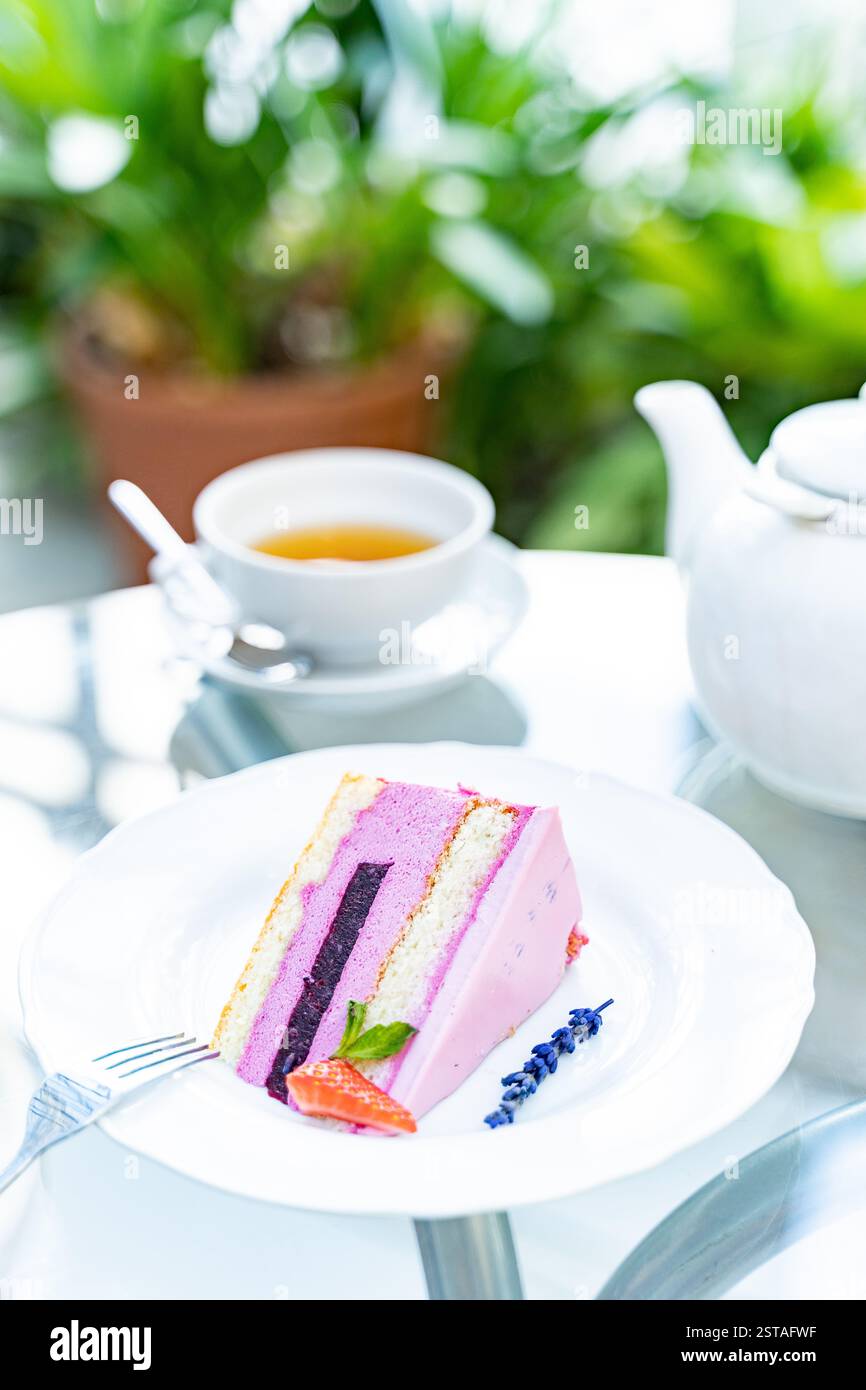 tea with lavender croissant and raspberry cheesecake for breakfast. white cup Stock Photo