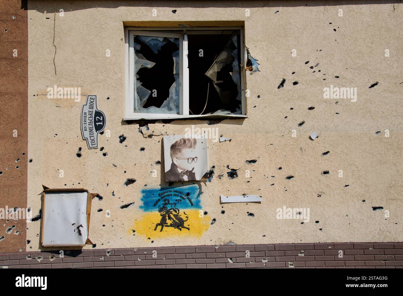 Photo shows the bullet-ridden ediface of a building destroyed by ...