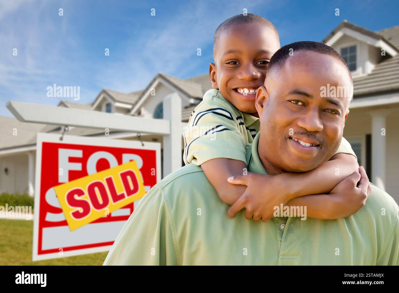 Happy African American Father and Son in Front of New Home and Sold ...