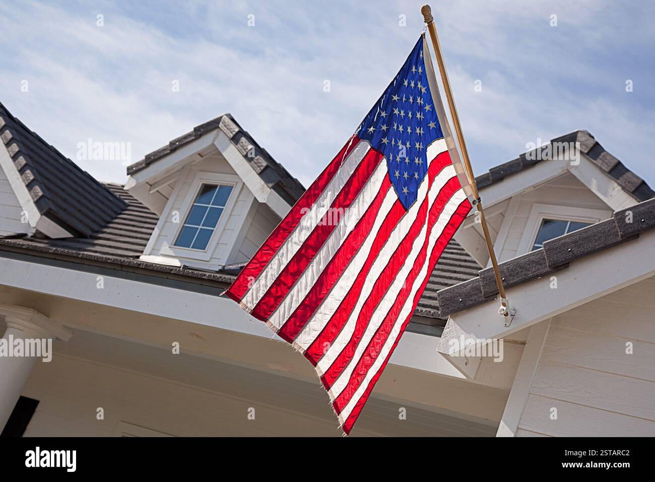 Abstract House Facade & American Flag Against a Blue Sky Stock Photo ...