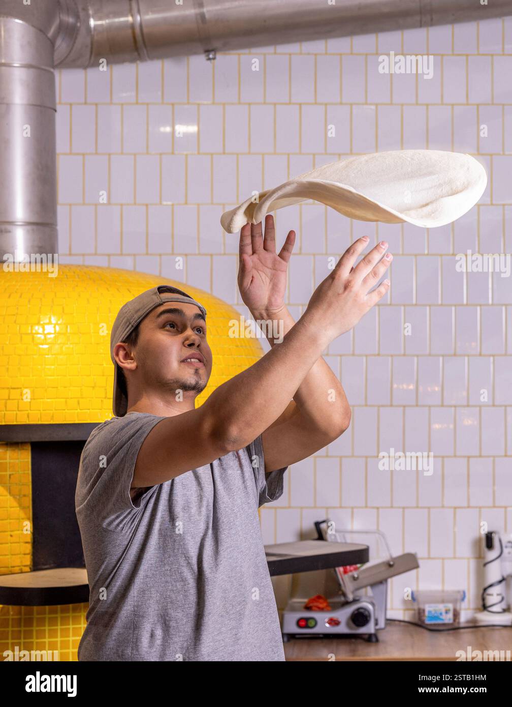 Pizza cooking professional chef stretches hi-res stock photography and ...