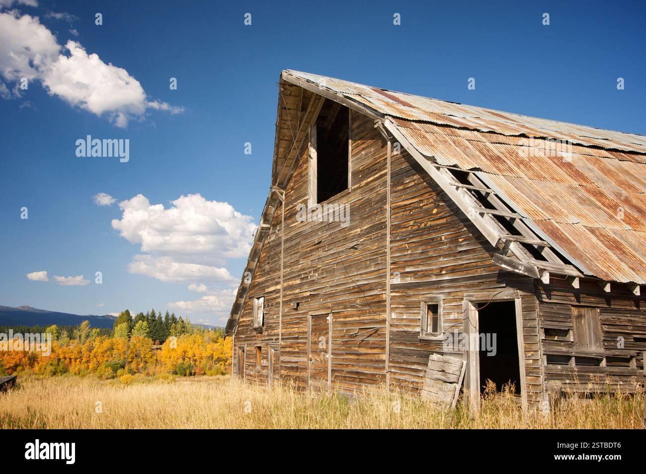 Rustic Barn Scene with Deep Blue Sky and Clouds Stock Photo - Alamy