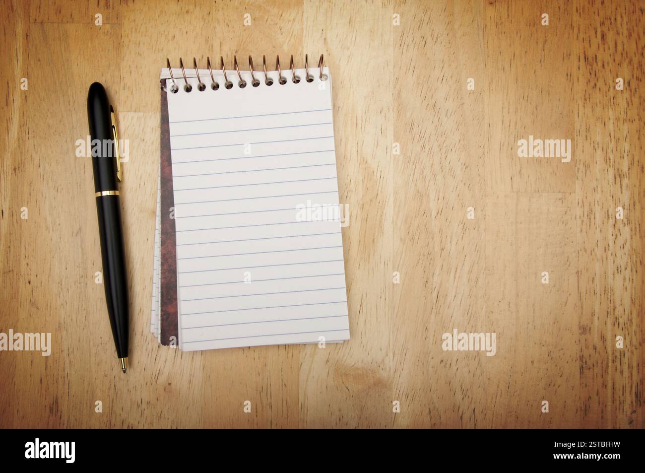Note Pad and Pen on Wood Stock Photo