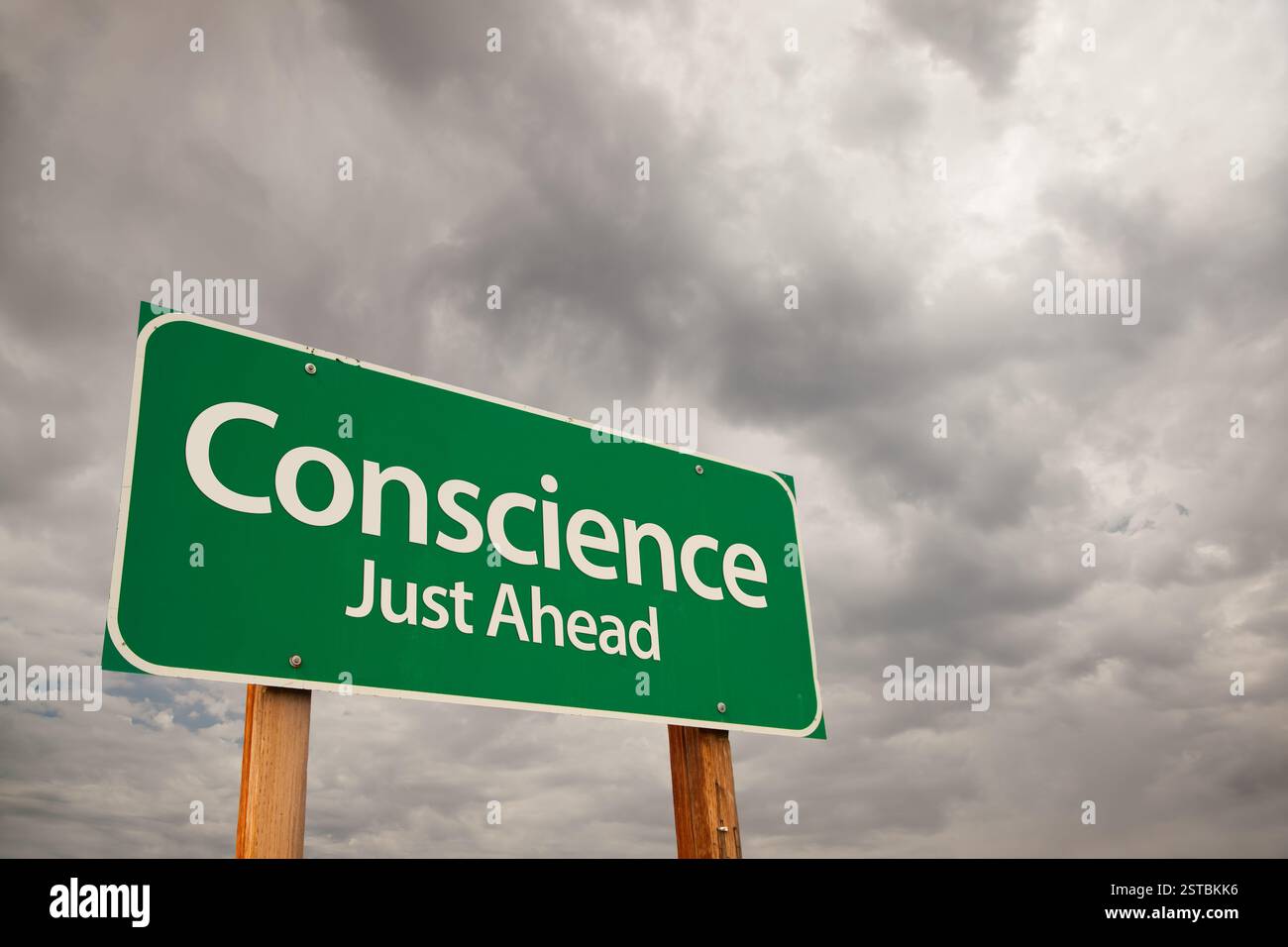 Conscience Green Road Sign Over Storm Clouds Stock Photo - Alamy