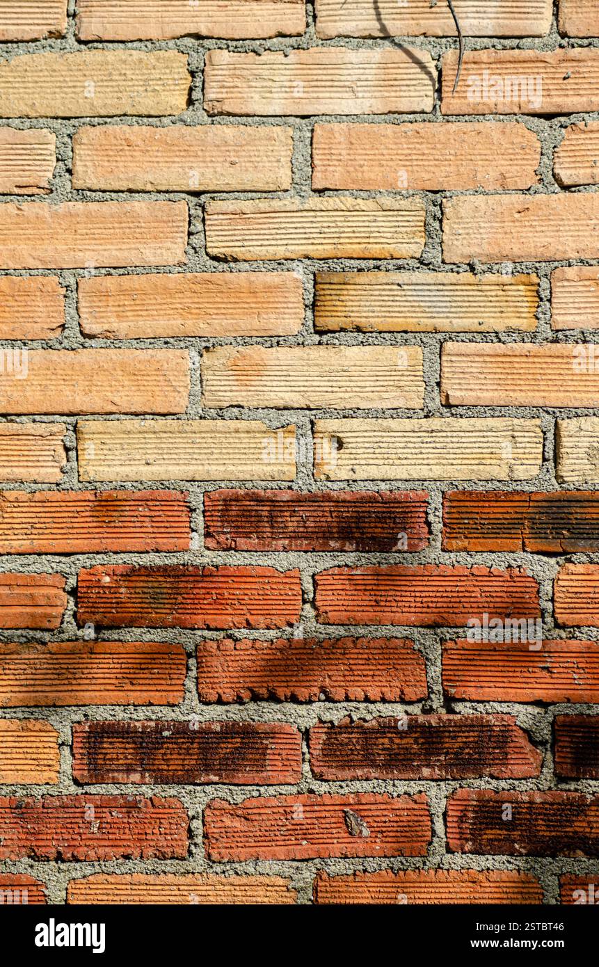 Weathered orange color brick wall for brickwork background design Stock Photo