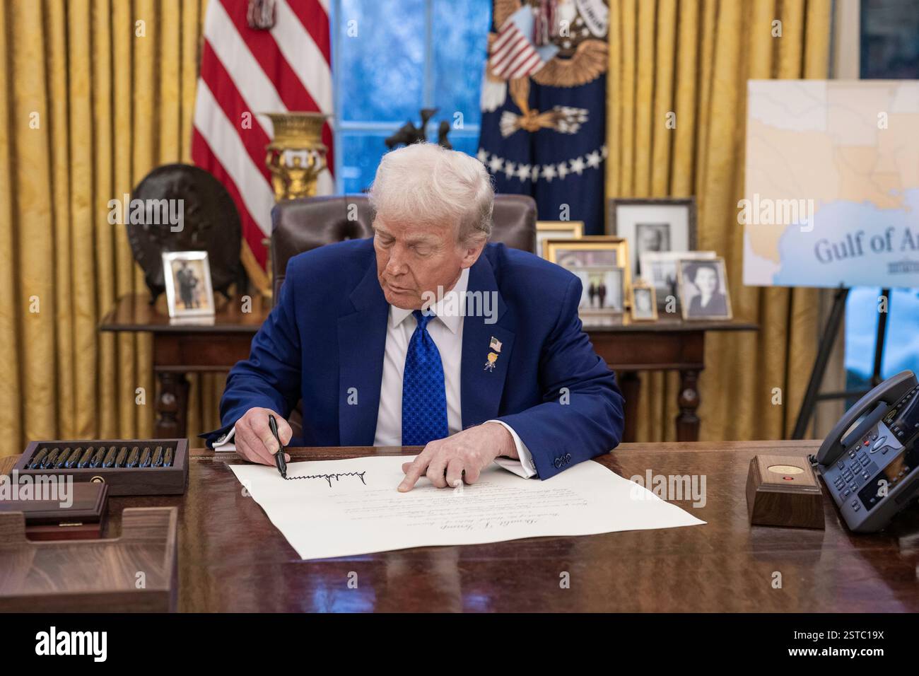 WASHINGTON DC, USA - 12 February 2025 - US President Donald J Trump with Tulsi Gabbard as she is sworn in as the Director of National Intelligence in Stock Photo