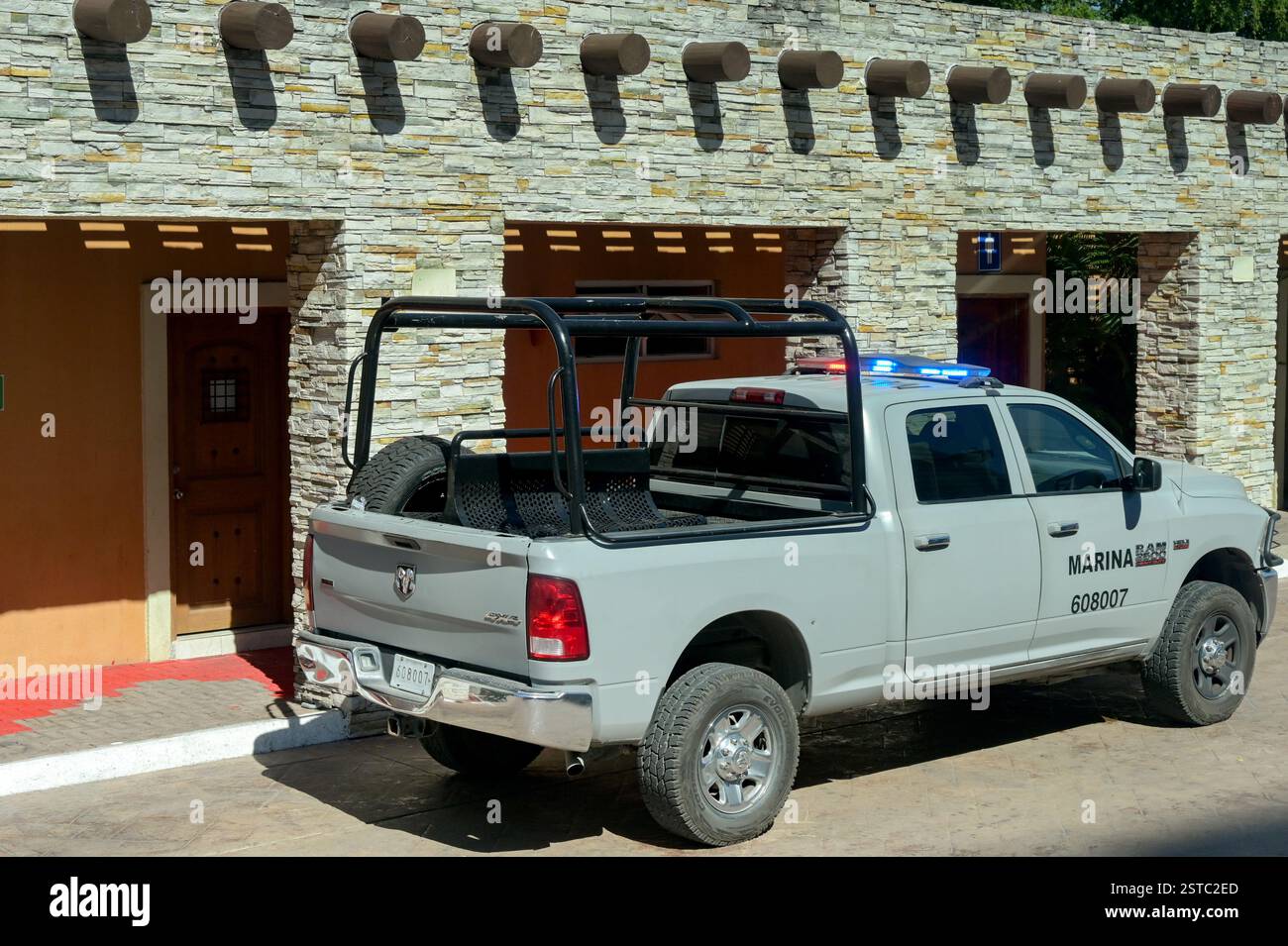 Puerto Vallarta, Mexico - 15 January 2025: Pickup truck with flashing blue lights used by the Marina police in the harbour of Puerto Vallarta Stock Photo