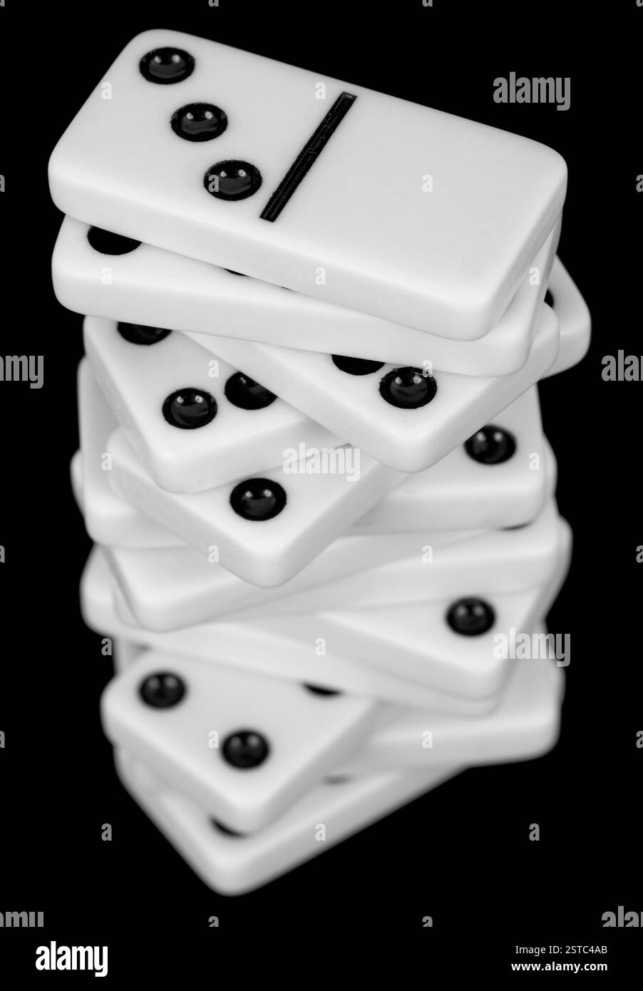 Pile from dominoes on black background Stock Photo