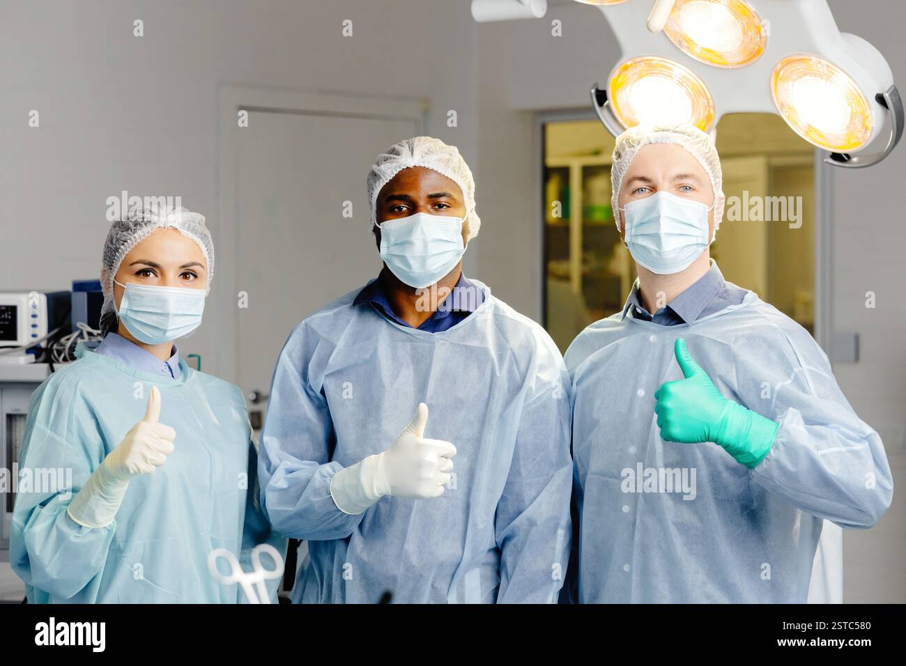 Group of doctors discussing patient cases around table. Stock Photo